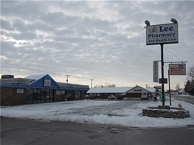 Entry way- Notice the metal gates all the way down. The dark room at the end of windows is the small room in the front corner of building.