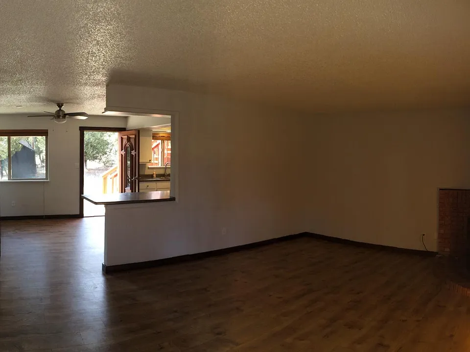 Living room with pellet stove and electric heat, open to kit