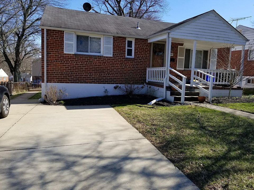 FRONT OF HOME, PARKING SPACE AND PAVED PATH TO BACK YARD.
