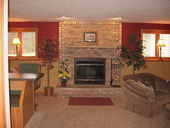 Family room with woodburning fireplace