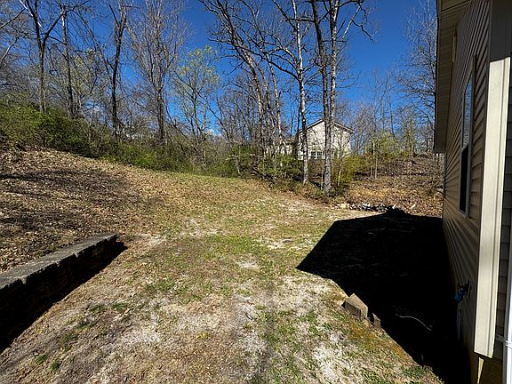 Backyard backs up to a wooded area for complete privacy