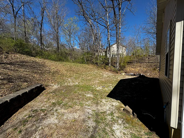 Backyard backs up to a wooded area for complete privacy