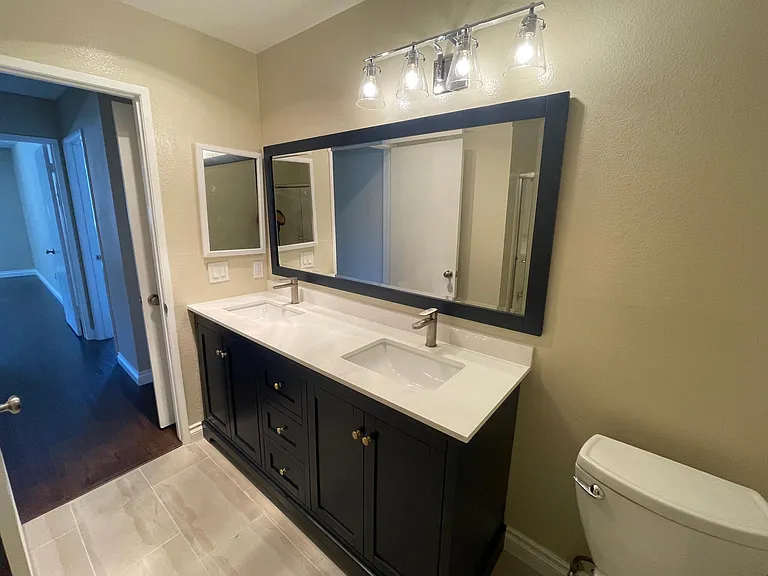 Bathroom #2 with modern and high-end fixtures and cabinets