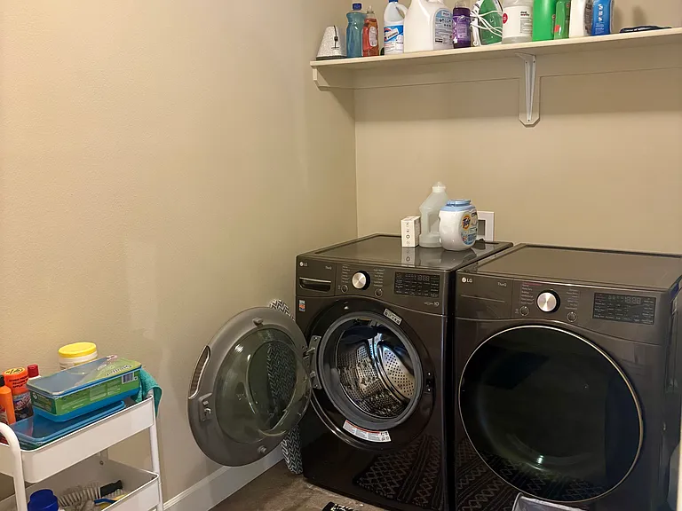 Large laundry room/arctic entry from garage offers a late 2024 washer/dryer in excellent condition