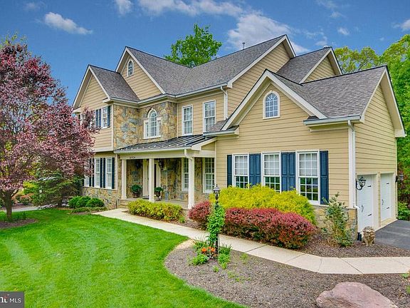 Inviting Covered Front Porch w/ Stone & Hardiplank