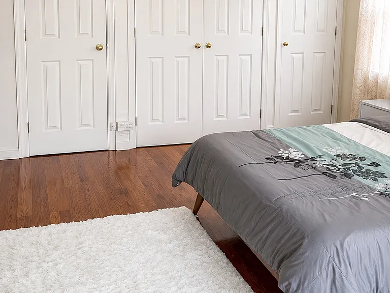 Master bedroom with 2 small closets and one large walk in closet