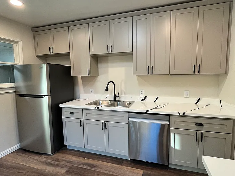 This beautiful kitchen includes custom cabinets and stainless steel appliances.
