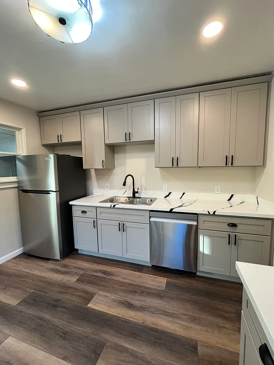 This beautiful kitchen includes custom cabinets and stainless steel appliances. - 3011 T St #A