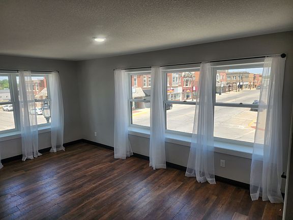 Living Room with 2nd story city square views