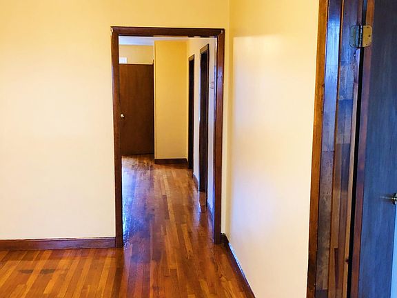 Hallway to all bedrooms on the right side of the unit.