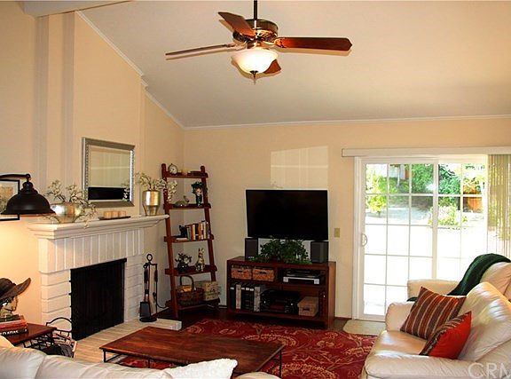 BRICK FIREPLACE WITH MANTEL, CEILING FAN/LIGHT