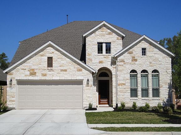 Three-side stone veneer house.