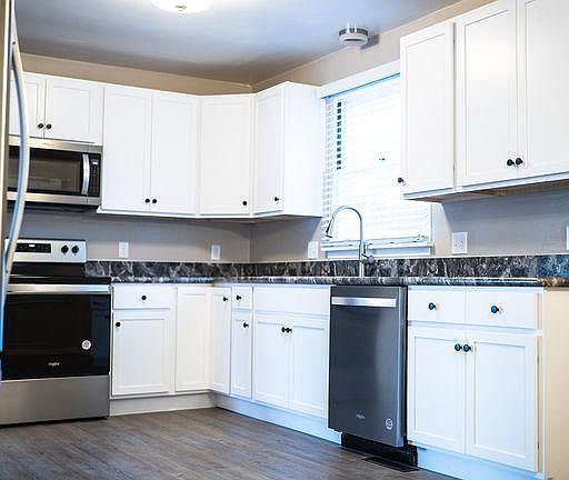 Completely updated kitchen, new flooring and appliances, DW, Microwave, restaurant style faucet. Plenty of storage. Granite-look laminate countertops.