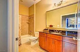 Guest bath located conveniently across from second bedroom.