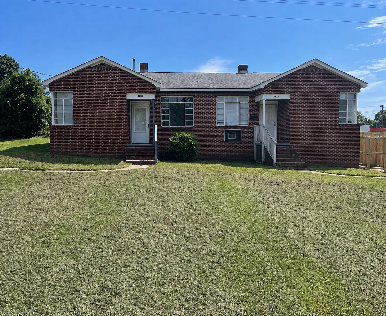This 2 bed 1 bath duplex home is all brick located near Remount Rd and West Blvd. — Photo 1