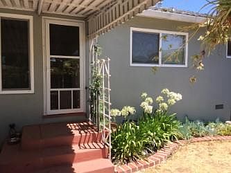 Door into living room with covered porch and outdoor area