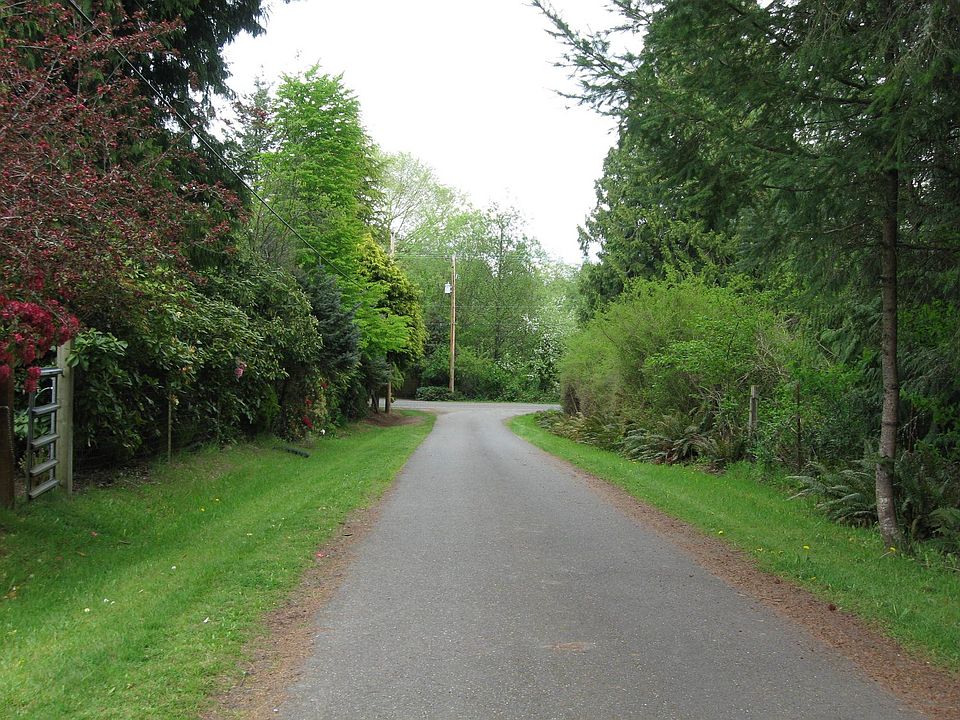 The 700 foot paved driveway that is owned and maintained by 4217 Libby Rd NE