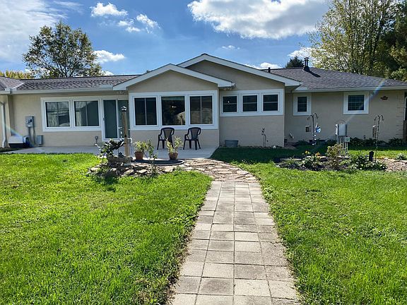 Back fenced yard with large patio
