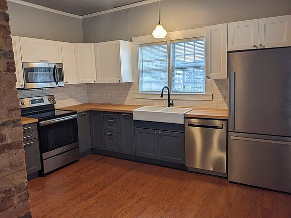 farm sink, built in microwave, smooth top stove, dishwasher, stainless appliances