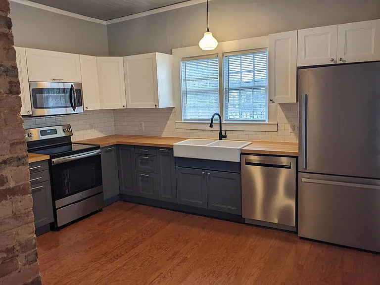 farm sink, built in microwave, smooth top stove, dishwasher, stainless appliances