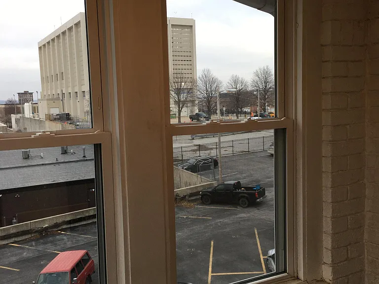Office view into gated parking lot