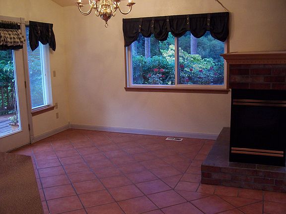 dining room with tiled floors and view of yard