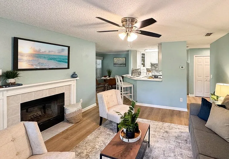 No popcorn ceiling! beautiful wide plank wood look LVP flooring.