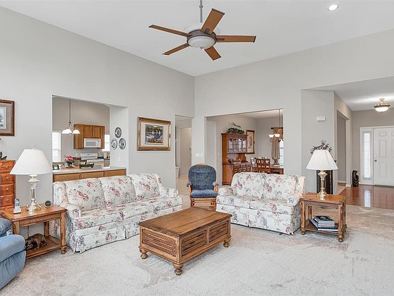 Family room open to the dining room, breakfast room and foyer.