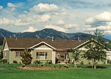 View of the back of home taken across the open "commons' area