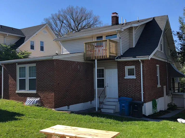 View from white fence looking toward back of house