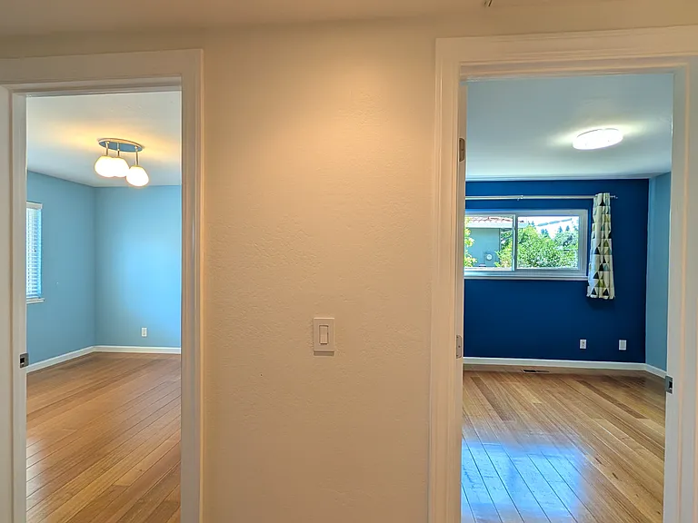 Hallway for the bedrooms, facing front and middle bedrooms.