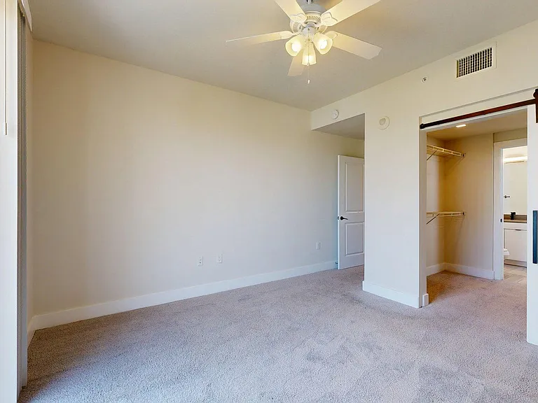 Spacious apartment Bedroom with Carpet Floor.