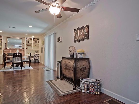 CREATIVELY BEING  USED AS A FORMAL DINING AREA, THIS SPACE WOULD SERVE WONDERFULLY AS A FAMILY ROOM!