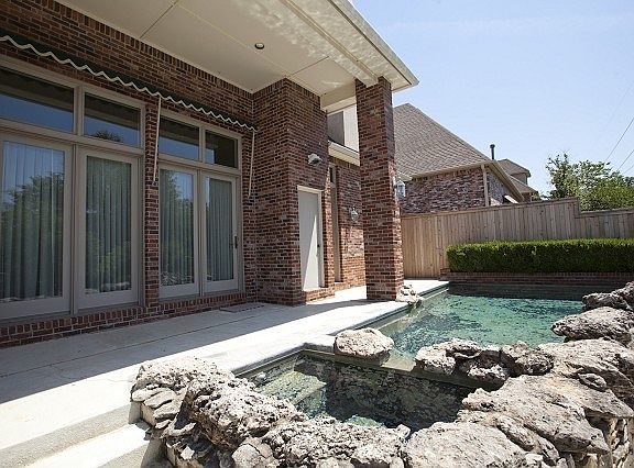Inviting Stone Oasis with Hot Tub