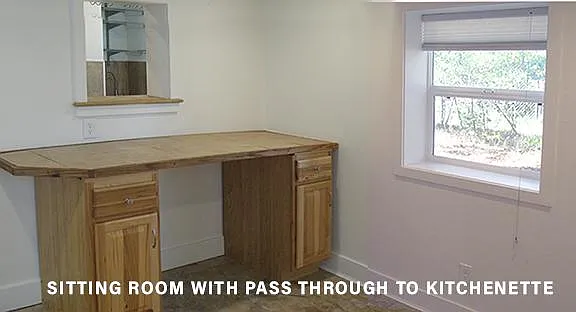 Sitting room with pass through to kitchenette.