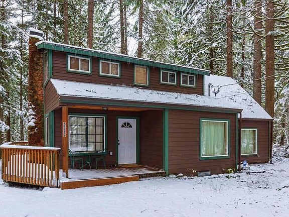 The beautiful house in the woods during winter wonderland.