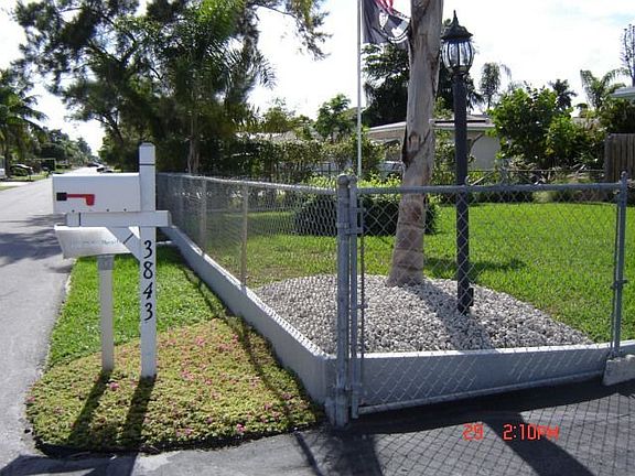 10" Concrete Footer With Embedded ChainLink Fence Surrounds Entire Property