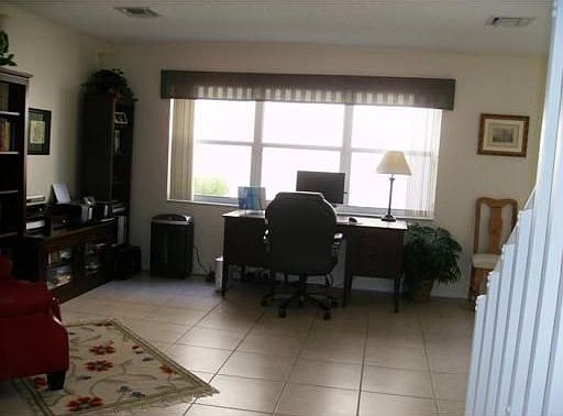 Living Room currently setup as in-home office