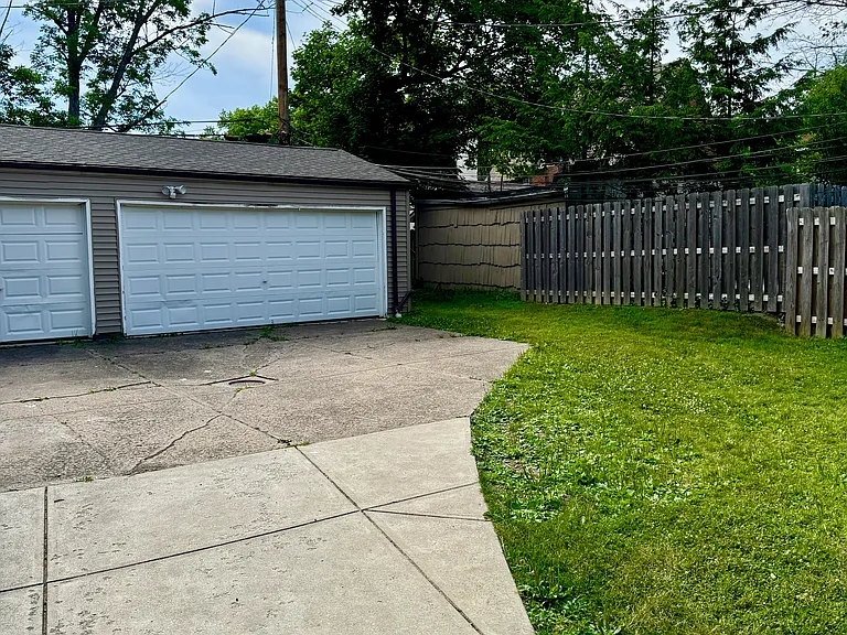 Garage and driveway parking available for added convenience.