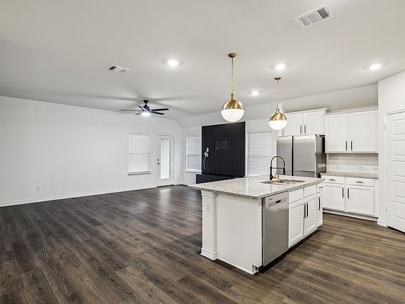 Living room with accent wall for your TV. This home has STYLE