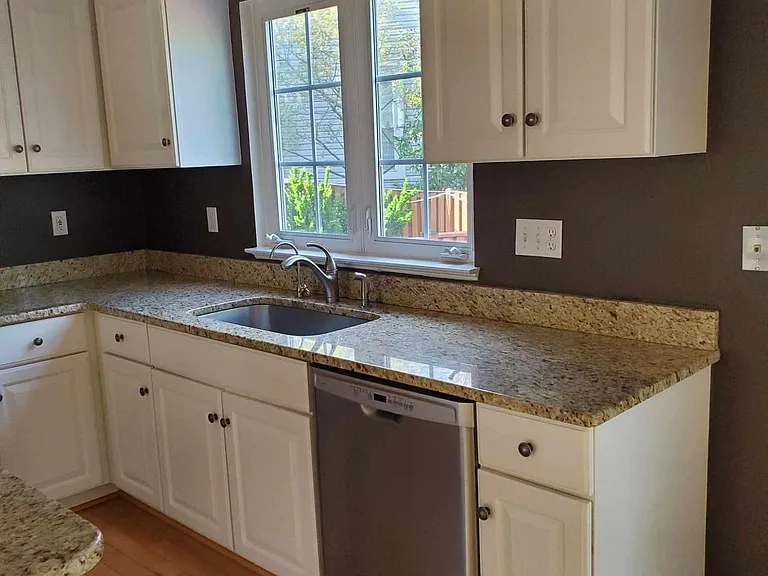 dishwasher only a couple years old. filtered water dispenser next to kitchen faucet