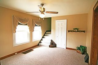 Custom made drapery adorn the living room.