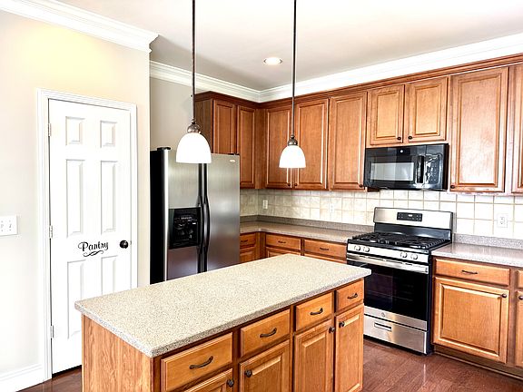 Kitchen with storage island and pantry