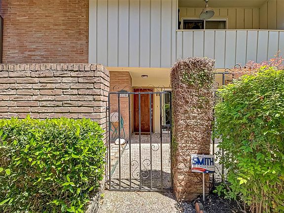 Upon entering the front door you will be amazed at the large patio area with a balcony above overlooking the courtyard.