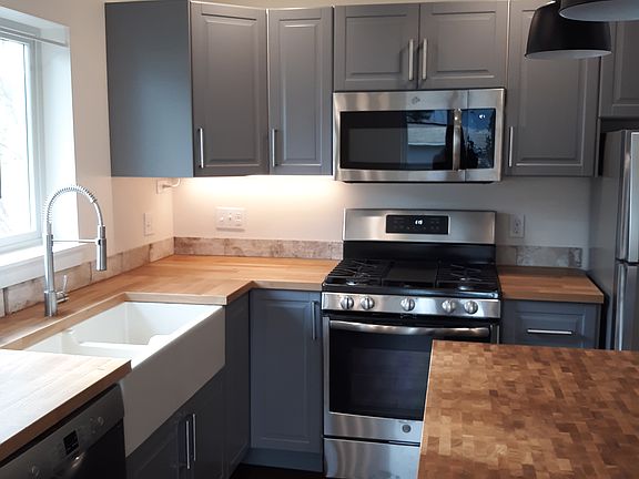 Italian farm-style sink.
Built in microwave. 
Full size kitchen.
Window overlooks garden.