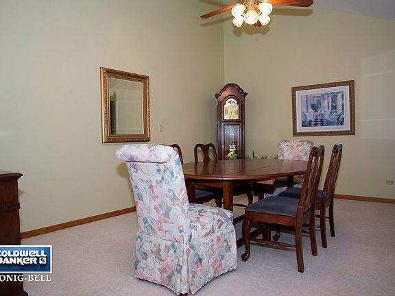 Formal dining room with vaulted ceiling