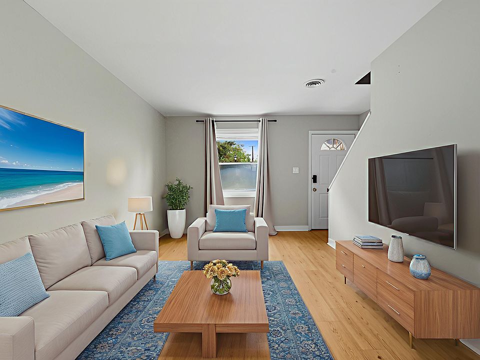 Living Area with washer/dryer in closet area.