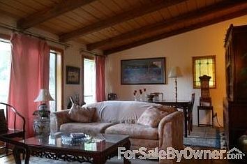 Living room
						:
						This living room has big windows a vaulted ceiling, gas log fireplace .