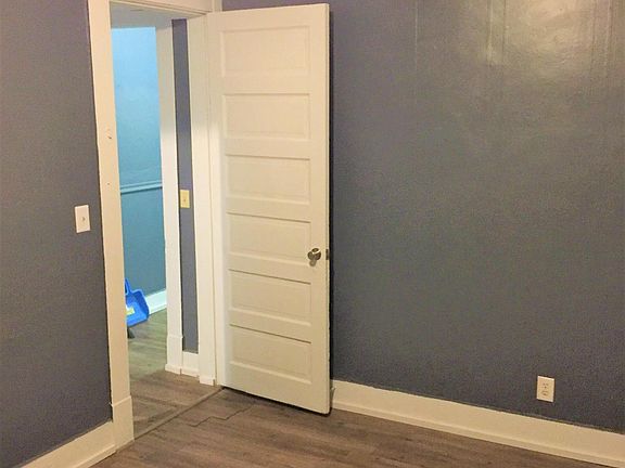 Bedroom with new flooring and ceiling fan