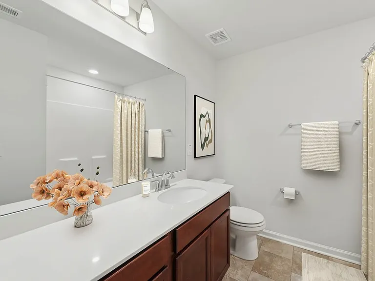 Classic Package Primary Bath with granite countertops, dual sink vanity, and tile flooring